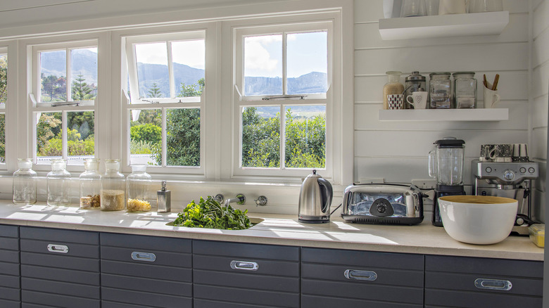Kitchen counter with several small appliances in one corner