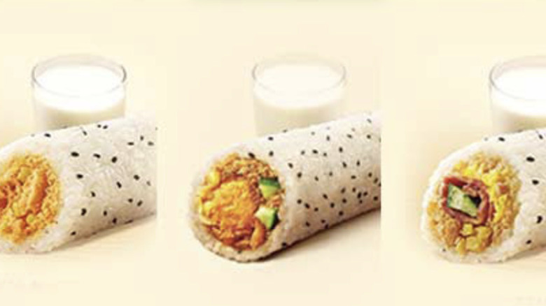 Three big rice balls from KFC China, with glasses of soy milk