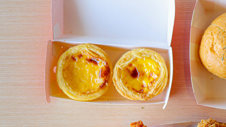 Egg tarts in a container from KFC Asia