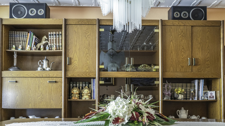 Shelves and cabinets with asymmetrical arrangements
