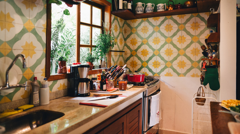 Kitchen with green and yellow geometric tile backsplash