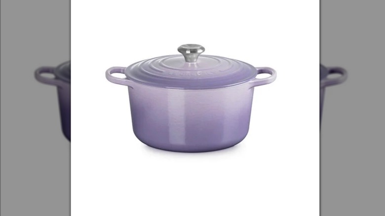 A lilac-colored, lidded Signature Round Deep Oven against a white background