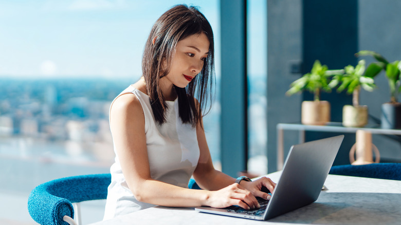 woman sitting at computer typing