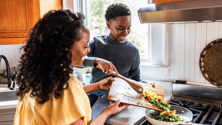 family cooking in bright kitchen