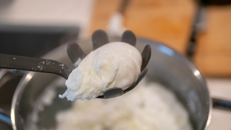 pasta claw removing poached egg