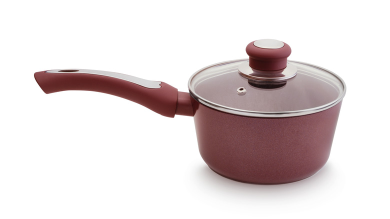 small red pan with lid