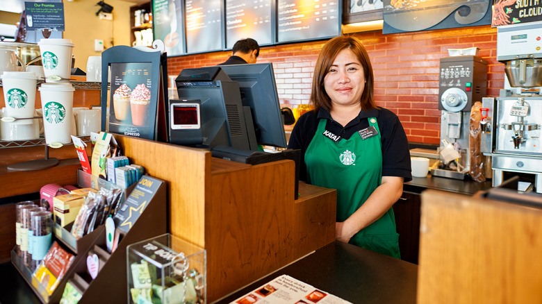 Starbucks employee at register