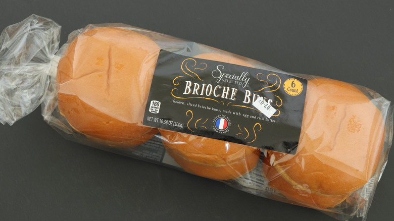 Specially Selected brioche buns on brown surface