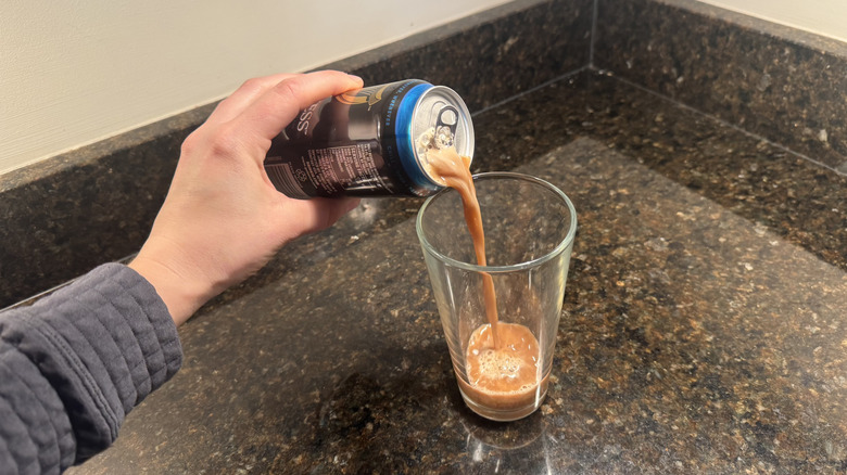 Pouring Guinness 0.0 into a glass