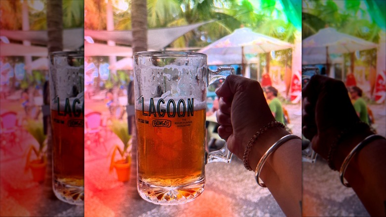 A person holding a beer with Bongo's Beer Garden in Florida in the background