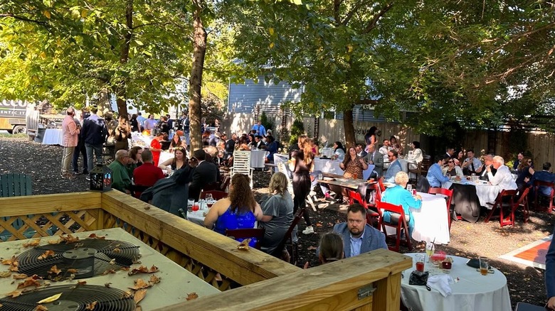 An outdoor beer garden filled with people at Forest City Brewing in Cleveland