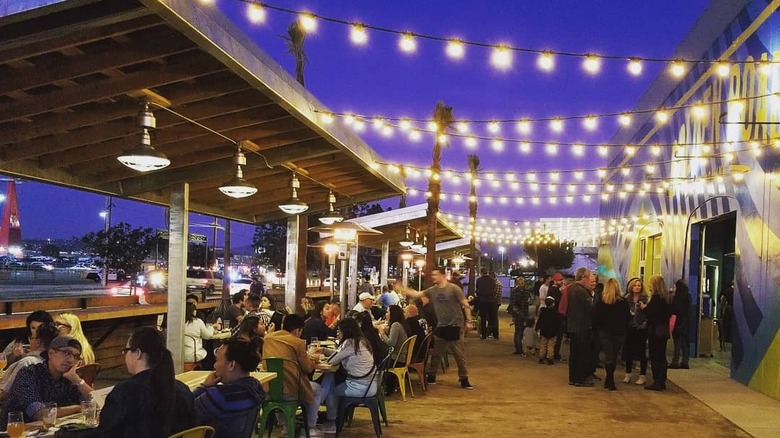 The outdoor beer garden at Golden Road Brewery at night
