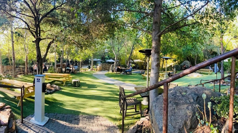Outdoor view of Stone Brewing Bistro and Gardens with empty tables