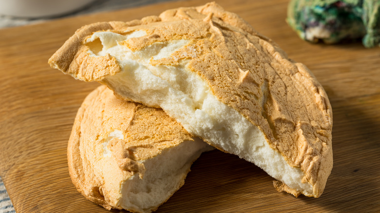 Twon halves of cloud bread on a wooden table