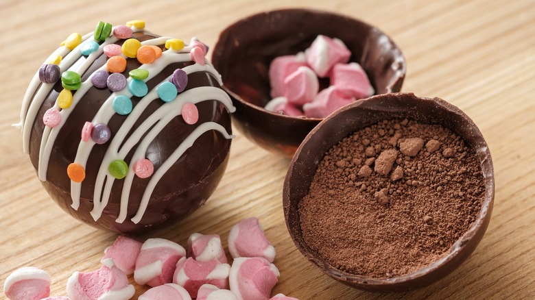 hot chocolate bombs with sprinkles on table