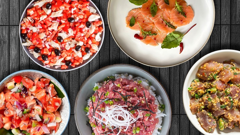 an array of raw seafood dishes on display