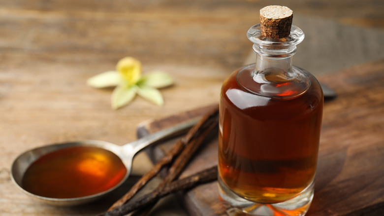 vanilla extract bottle and flower