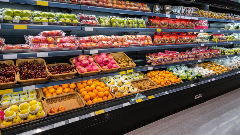 The fruits section of a produce aisle in a grocery store