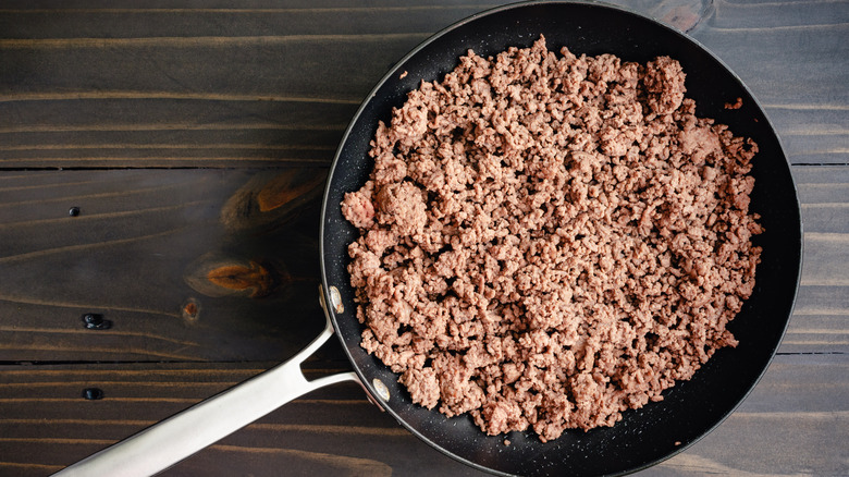 Cooked ground beef in a nonstick frying pan