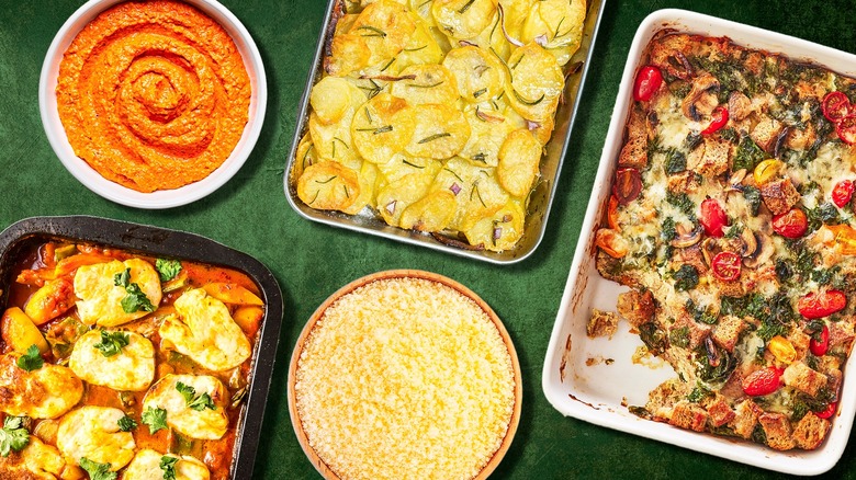 Assorted casserole dishes laid out on a green background