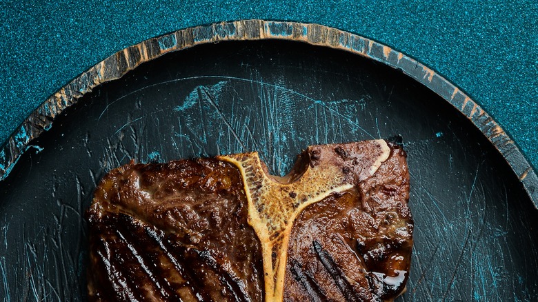 overdone looking T bone steak