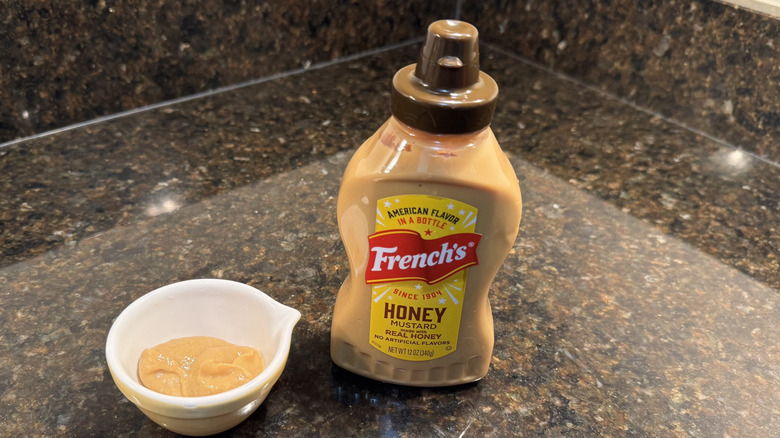 Honey mustard with ramekin on a counter