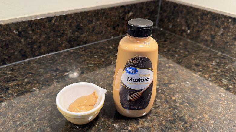 Honey mustard with ramekin on a counter