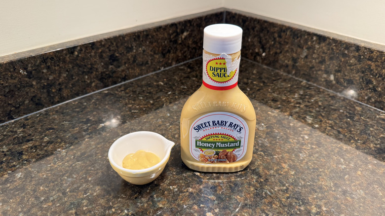 Honey mustard with ramekin on a counter
