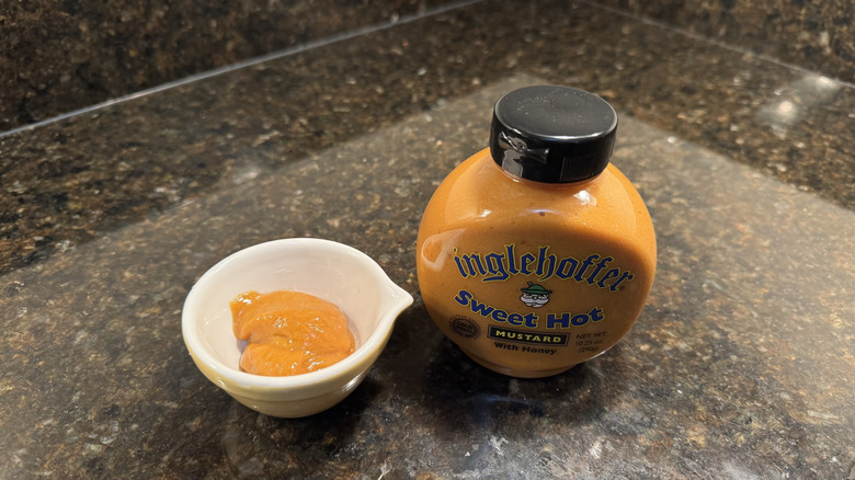 Honey mustard with ramekin on a counter