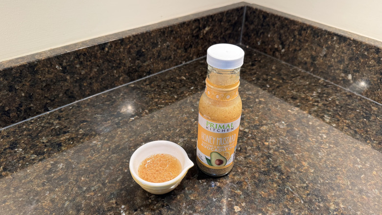 Honey mustard with ramekin on a counter