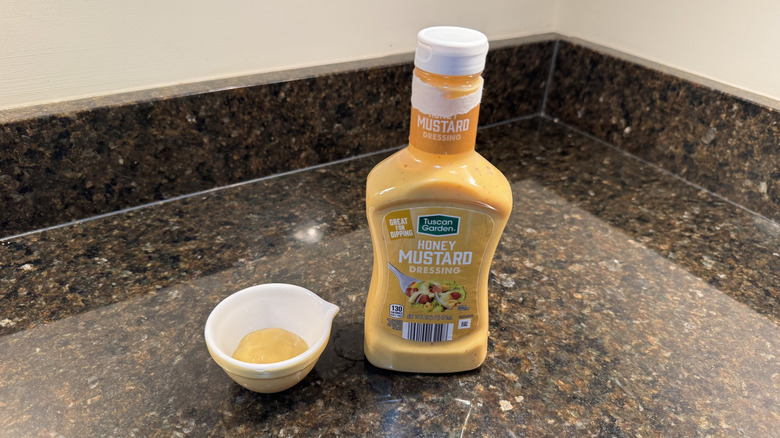 Honey mustard with ramekin on a counter