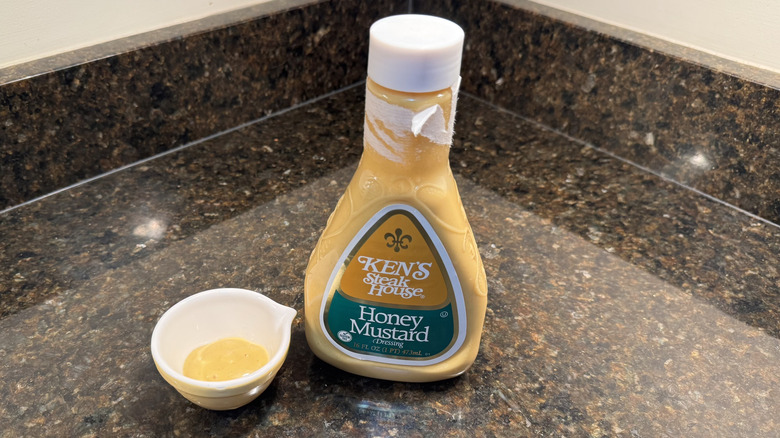 Honey mustard with ramekin on a counter