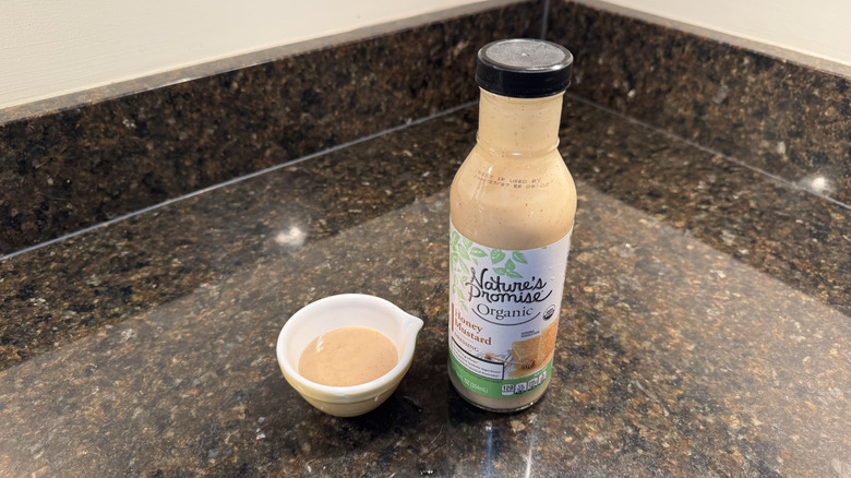 Honey mustard with ramekin on a counter
