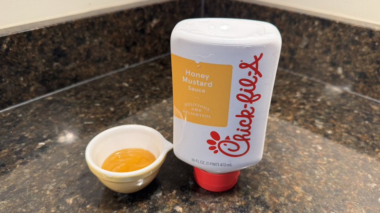 Honey mustard with ramekin on a counter