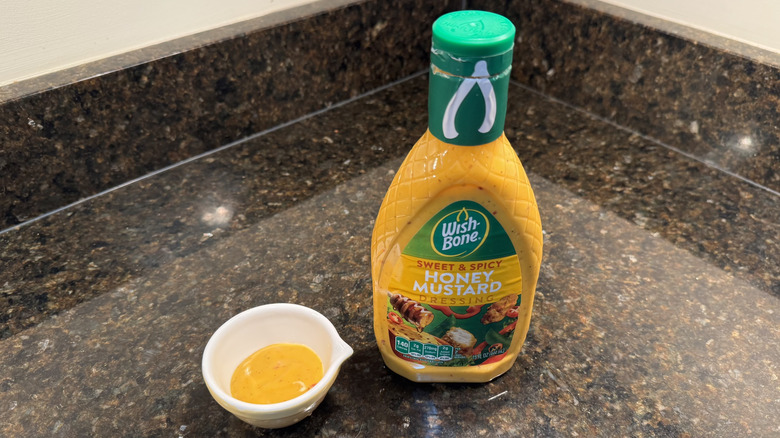 Honey mustard with ramekin on a counter