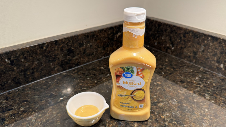 Honey mustard with ramekin on a counter