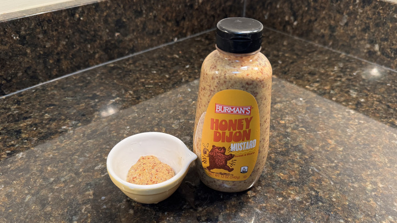 Honey mustard with ramekin on a counter