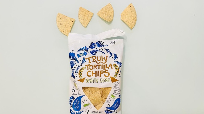 A bag of Trader Joe's White Cron Truly Tortilla Chips is shown.