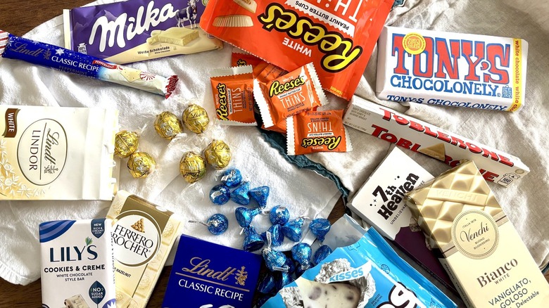 Assortment of white chocolate bars and candies
