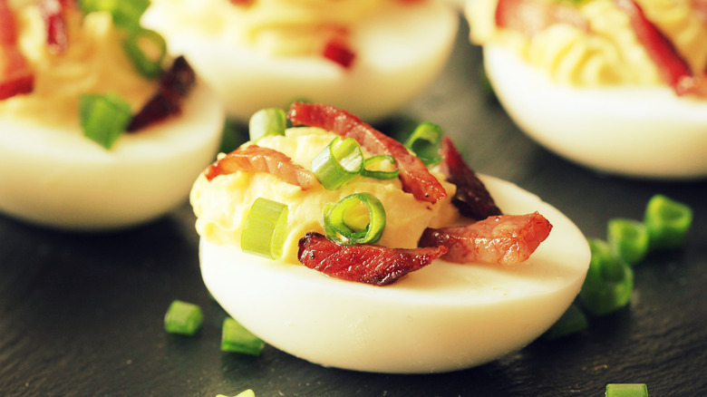 Deviled eggs with bacon and green onion