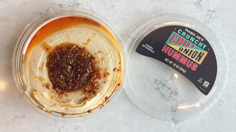An open container of Trader Joe's Crunchy Chili Onion Hummus
