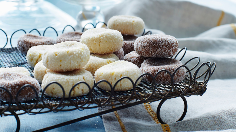 A black wired basket of fave dei morti cookies