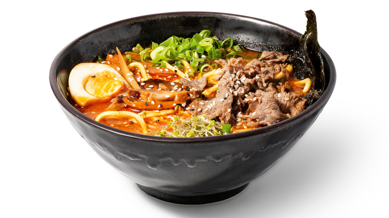 a black bowl with gyukotsu on an isolated white background