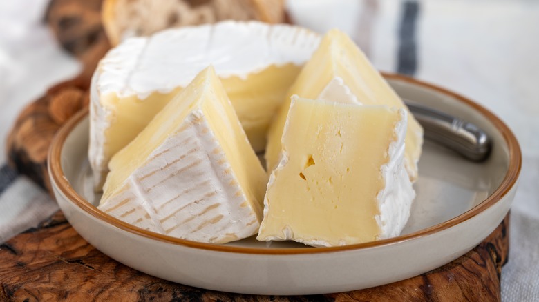 Slices of Camembert cheese on a plate