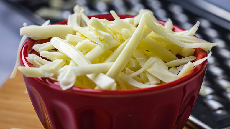 Grated Monterey Jack cheese in a dish