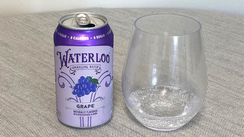 Grape Waterloo in a can beside a glass of it
