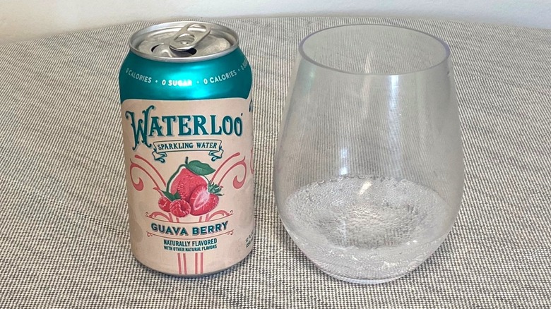 Guava Berry Waterloo on a table beside a glass of it