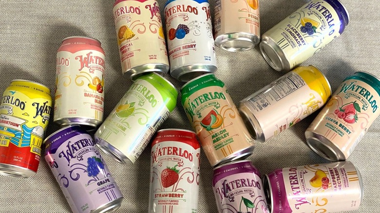 15 Waterloo flavors ranged around on a beige backdrop