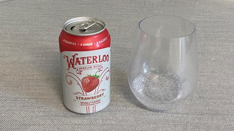 Strawberry Waterloo flavor in a can next to a glass