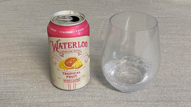 Tropical Fruit Waterloo flavor in a can next to a glass